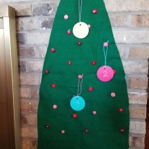 Every day, hang another ornament on the tree until Christmas. The clothespins can then hold Christmas cards as they come in.